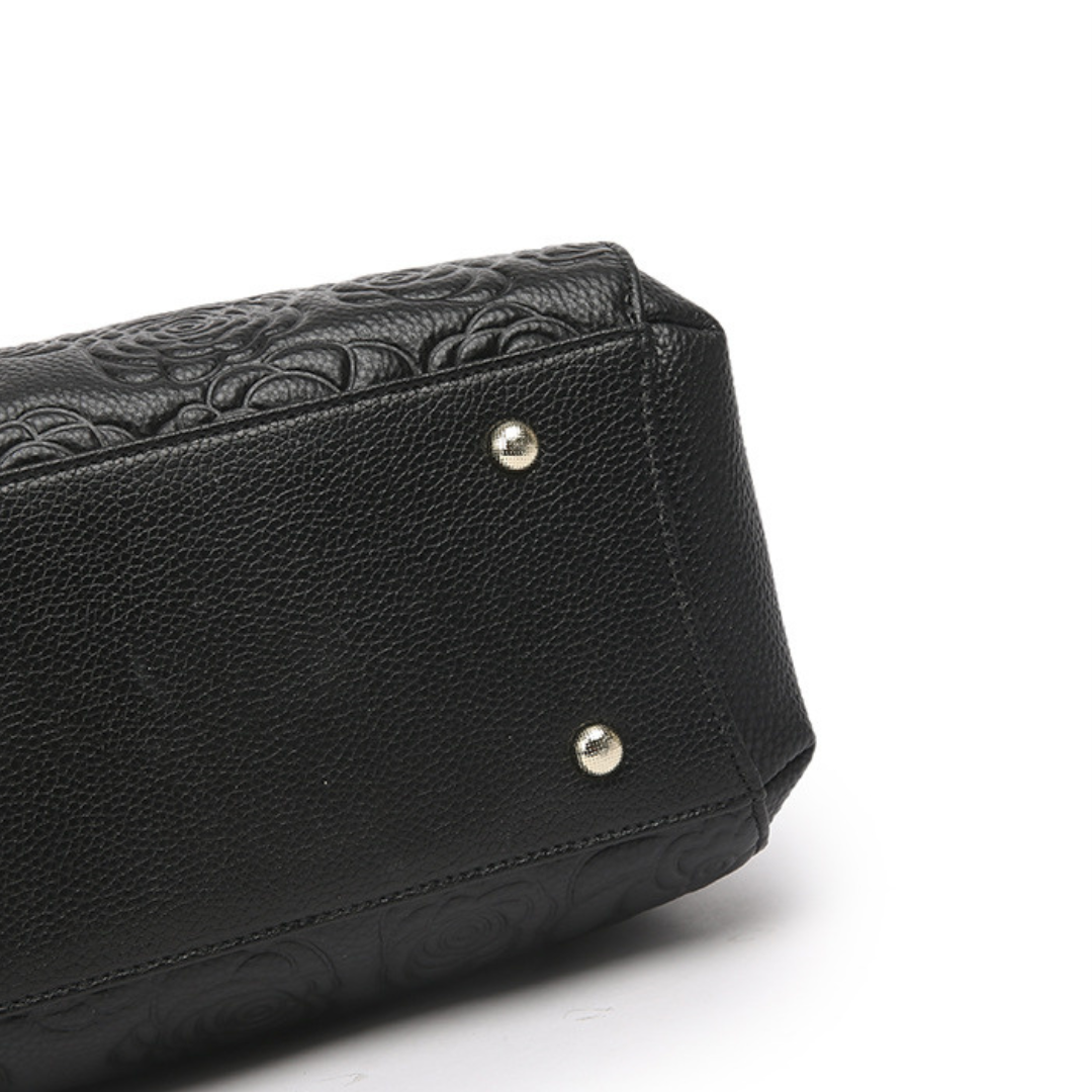 <tc>Stacy Handtasche mit Blumenprägung</tc>