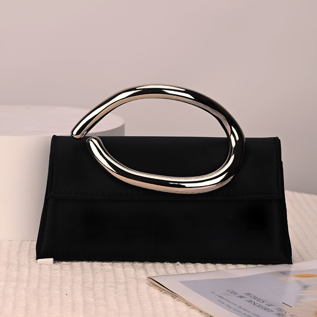 <tc>Liz Clutch mit geformtem Griff</tc>