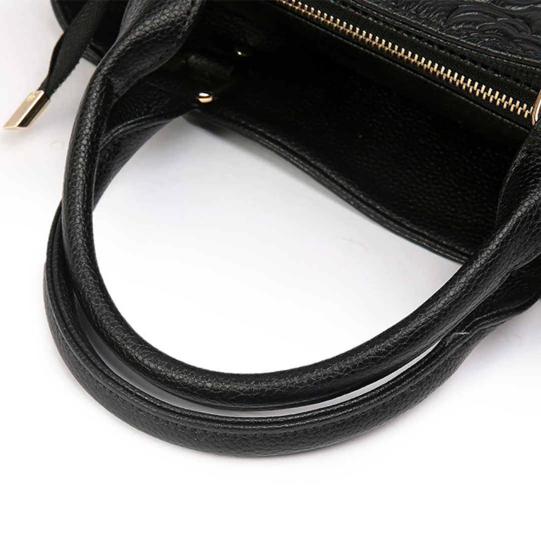 <tc>Stacy Handtasche mit Blumenprägung</tc>